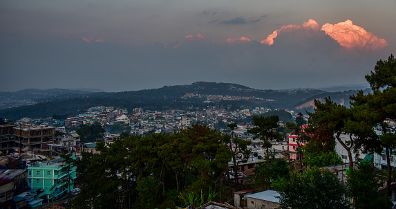Shillong city skyline with red clouds .