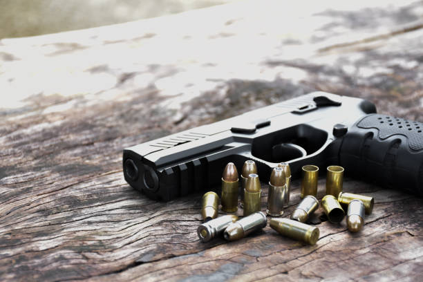 istock Automatic black 9mm pistol gun and bullets 1806056132