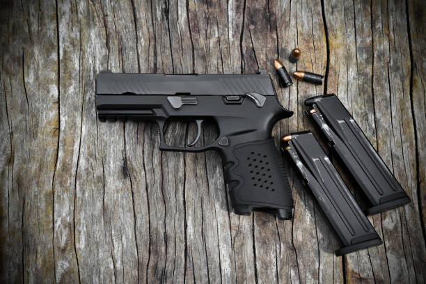 istock Automatic black 9mm pistol gun and bullets 1806061208