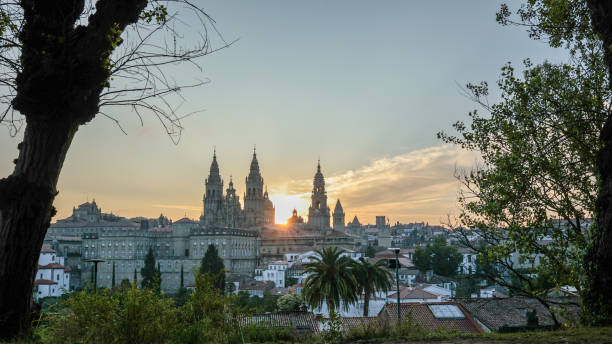 Witness the awe-inspiring sunrise at St. James Cathedral, Santiago de Compostela, a revered religious site central to the transformative journey of the Camino de Santiago pilgrimage. Discover its majestic history and profound spiritual significance.
