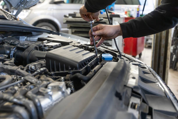 istock Professional car servis man changing the air filter by the car engine, car service concept 1806069421