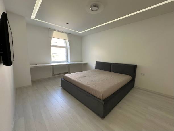 istock minimalist bedroom, white floor and white walls 1806073002