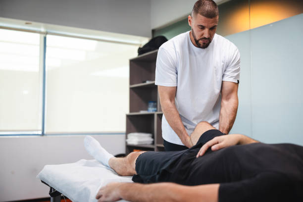 istock Young masseur massaging his client in his office 1806083199
