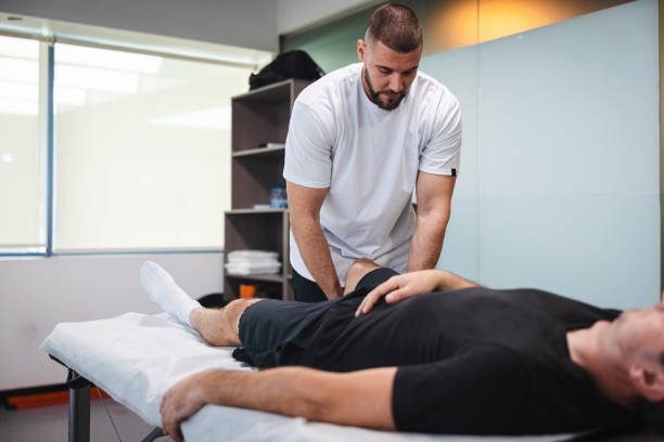 istock Young masseur massaging his client in his office 1806083206
