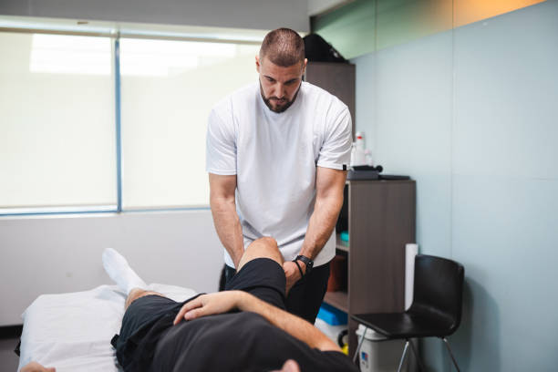istock Young masseur massaging his client in his office 1806083207
