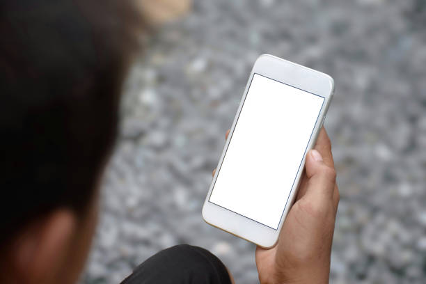 istock Children hand holding smartphone white screen top-view and soft focus in blurred background concept of electronic devices and social media for business, subject is blurred and noise 1806094157