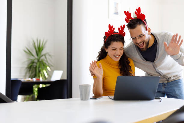 istock Two People Celebrating New Year in Modern Office 1806114023