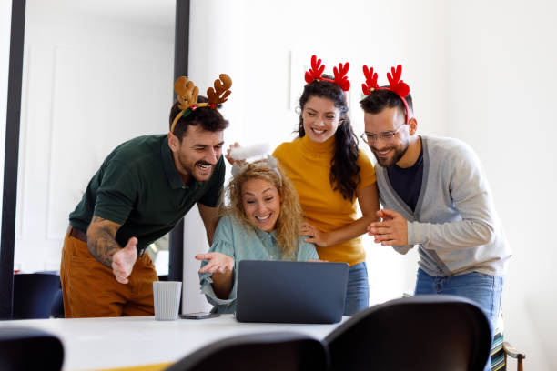 istock Young People Celebrating New Year in Modern Office 1806114375