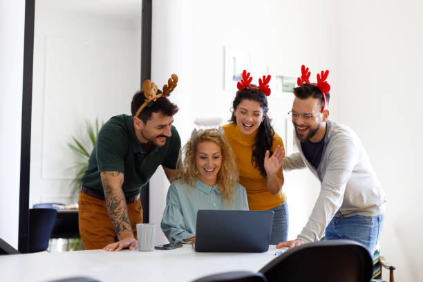istock Young People Celebrating New Year in Modern Office 1806114386