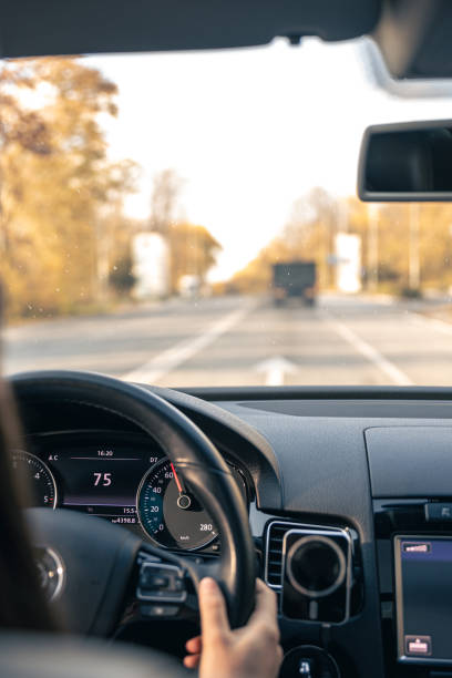 istock Woman driver hands on steering wheel inside car. 1806116653