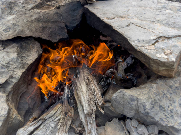istock The burning shape and patterns of the juniper tree. Warming in the mountains, campfire and its magnificent relaxing texture. 1806116672