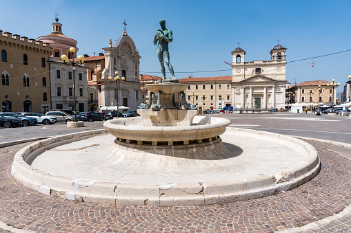 L'Aquila, Italy-august 11, 2021:view of the old fountain in the cathedral square in L'Aquila during a sunny day