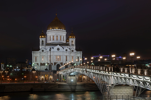 View of the Cathedral of Christ the Savior and the Patriarchal Bridge from the Beresnevskaya embankment of the Moskva River at night, Moscow, Russia