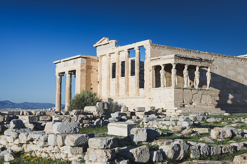 Temple of Erechtheion on Acropolis of Athens, blue sky background. Greece stock photo.