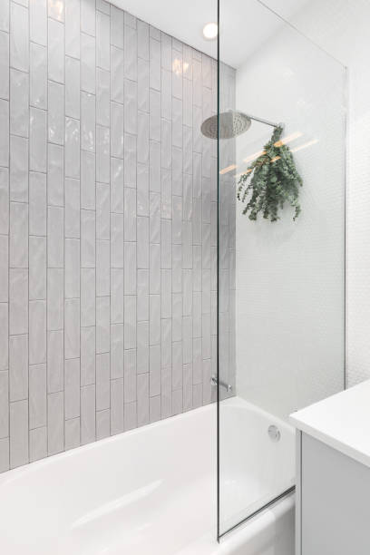 istock A shower detail with vertical subway and white circular tiles. 1806164139