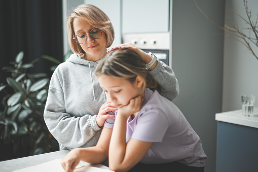 mother and daughter doing homework