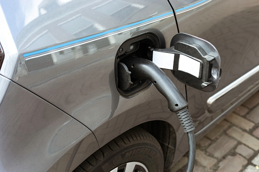 Close up of charging of an electric car.