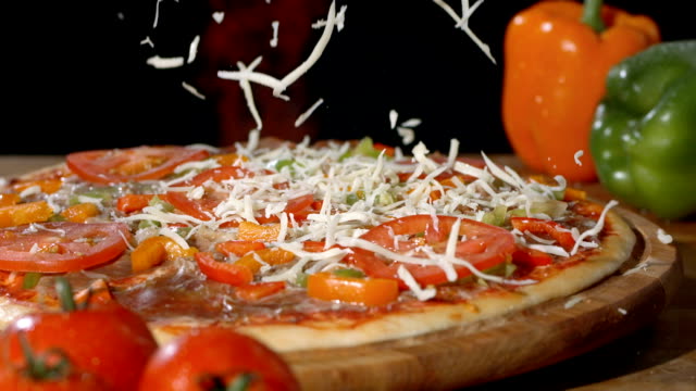 HD Super Slow-Mo: Adding A Sprinkle Of Cheese On Pizza