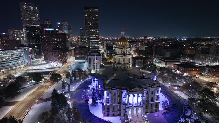 Aerial Orbiting Shot of Colorado State Capitol at Night with Downtown Denver in Background