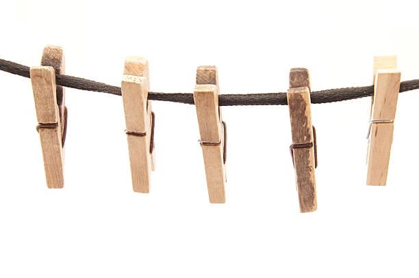 istock Clothespins and rope on a white background 180617590