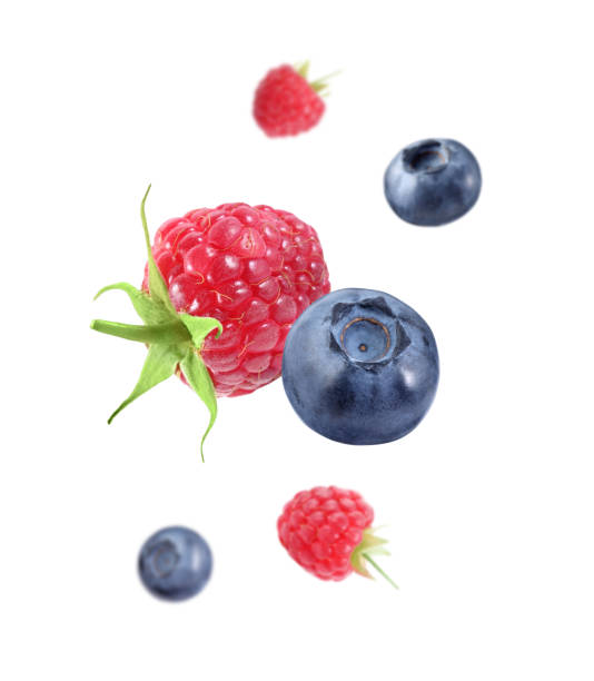 istock Fresh ripe blueberries and strawberries falling on white background 1806180502