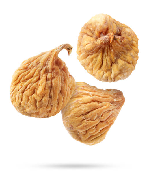istock Dried figs falling on white background. Exotic fruit 1806182751