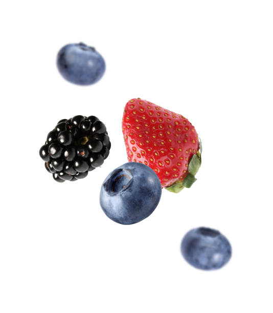 istock Fresh ripe blueberries, strawberry and blackberry falling on white background 1806183351