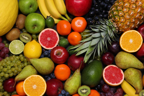 istock Different ripe fruits and berries as background, top view 1806183907