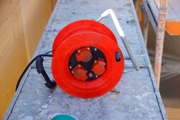 istock Red cable drum lies on a scaffolding 1806183953