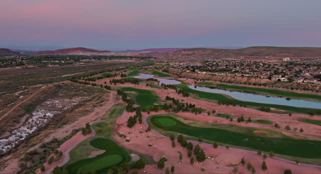 Suburban Houses Built Around Golf Course in St. George, Utah at Dusk - Aerial