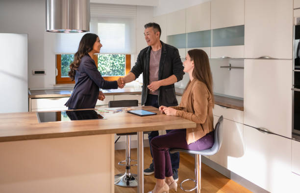 istock New House Owner Shaking Hands With Real Estate Agent 1806201260