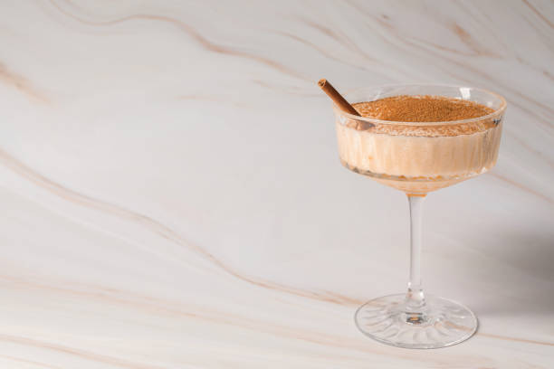 istock Delicious eggnog with cinnamon on white marble table. Space for text 1806206725