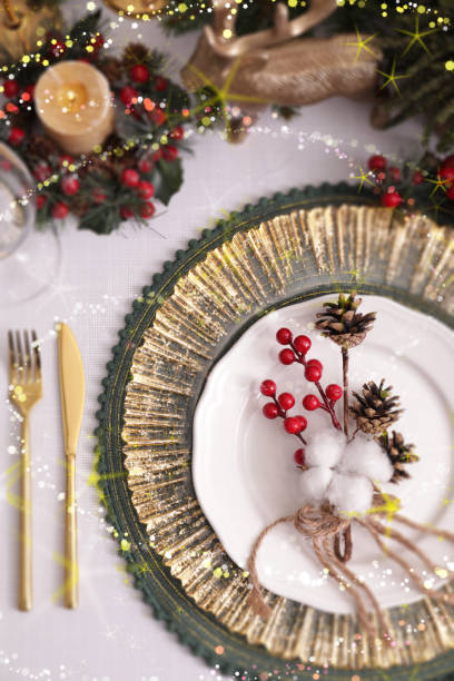 istock Christmas place setting for festive dinner on white table, flat lay. Bokeh effect 1806207816