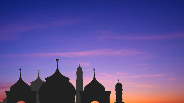 istock Silhouette Mosque domes with towers against colorful dramatic twilight sky background in evening time during iftar period in Ramadan Holy month 1806217886