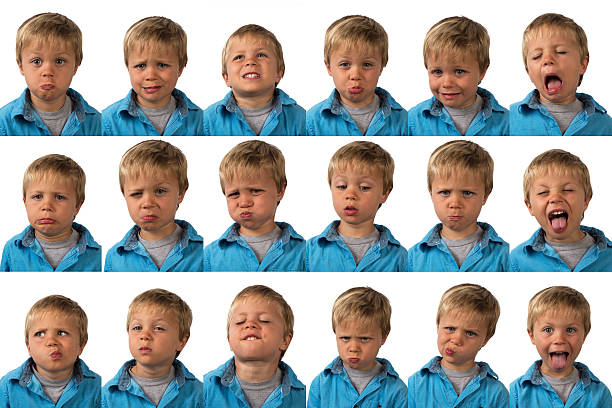 Expressions - five year old boy A five year old boy posing for 16 different facial expressions. child laughing hysterically stock pictures, royalty-free photos & images