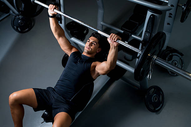 Young Man Working Out in the Gym stock photo