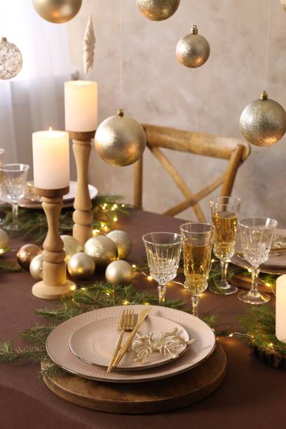 istock Christmas table setting with burning candles and festive decor 1806233071