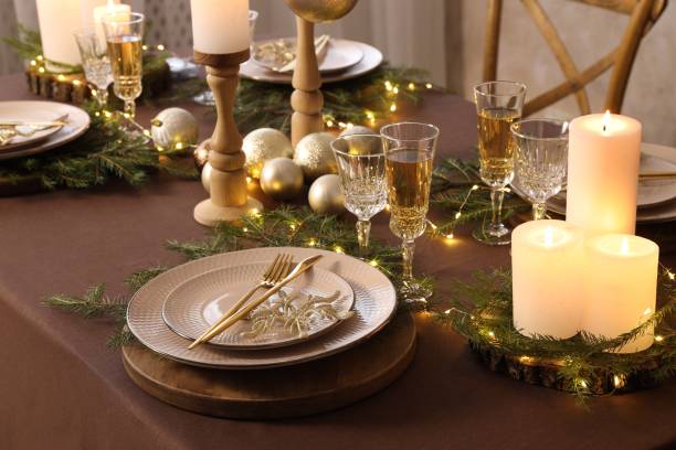 istock Christmas table setting with burning candles and festive decor 1806233072