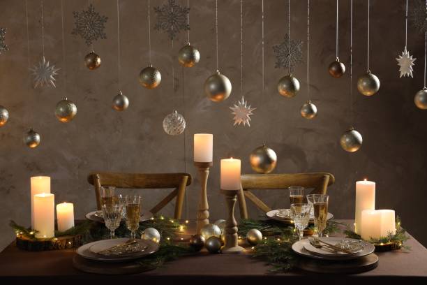 istock Christmas table setting with burning candles and festive decor 1806233449