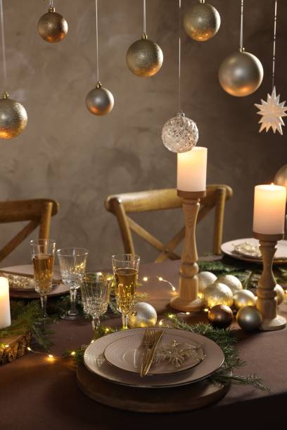 istock Christmas table setting with burning candles and festive decor 1806233600