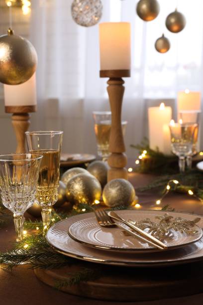 istock Christmas table setting with burning candles and festive decor 1806233612