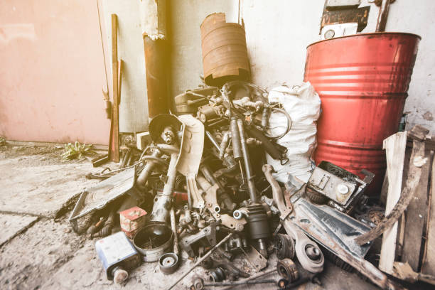 a pile of removed used car parts at a technical service station stacked for scrap metal - rust metal imagens e fotografias de stock