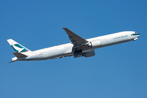 Hong Kong / China - December 1, 2013: Cathay Pacific Airways Boeing 777-300ER B-KQD passenger plane departure and take off at Hong Kong Chek Lap Kok Airport