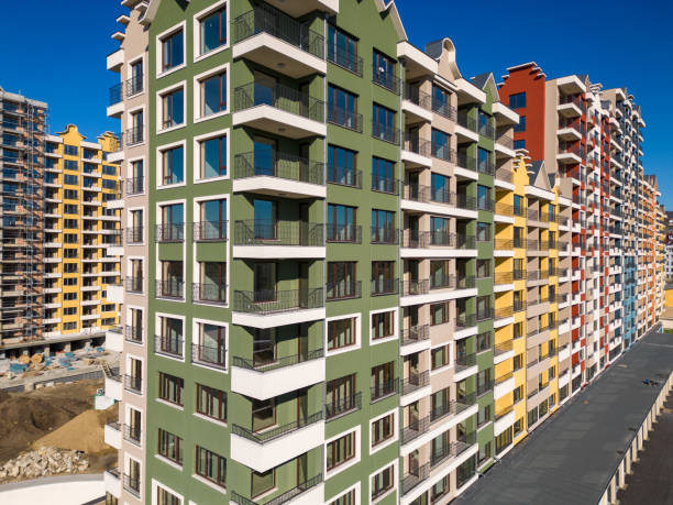 istock Drone flight along the facade of a modern apartment building under construction surrounded by scaffolding. Varna, Bulgaria 1806271064
