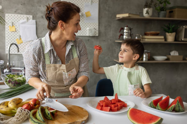 istock Boy with grandmother in kitchen 1806273267
