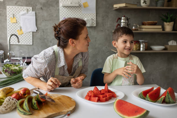 istock Boy with grandmother in kitchen 1806273814