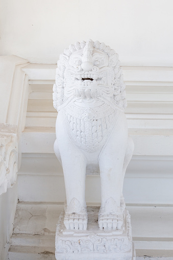 white lion in the white temple of Thailand Wat Sawang Arom.