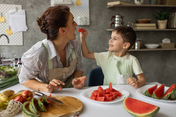 istock Boy giving watermelon to grandmother 1806276021