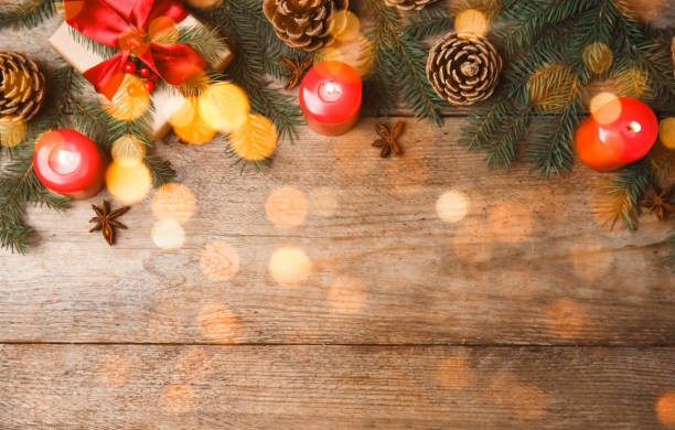istock Beautiful Christmas composition with fir tree branches and space for text on wooden table, flat lay. Bokeh effect 1806280250