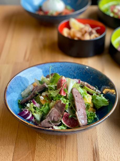 istock Mixed lettuces with roasted duck and fig. 1806282470